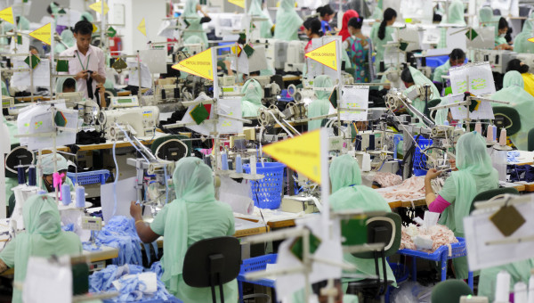 A general view shows lines of garment workers and their supervisors in a clothing manufacturing plant in Bangladesh