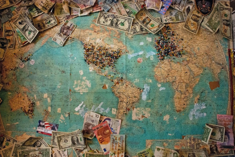 World map with money bills 